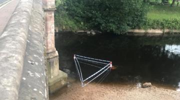 Tape marks area of River Eden at Appleby after an obstruction is found.